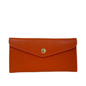 LE BORSETTE's LEATHER ENVELOPE STYLE WALLET in orange leather features a textured finish, a triangular flap, and a gold button closure, shown on a plain white background.