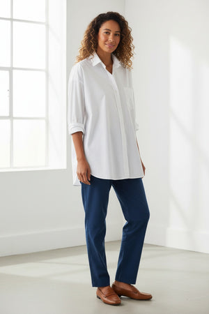 The FRANK AND EILEEN - SHIRLEY OVERSIZED BUTTON UP SHIRT features rolled long sleeves, a classic collar, a chest pocket, and an oversized fit. Made from 100% cotton poplin in classic white, the label inside is partially visible, making it ideal for casual wear.
