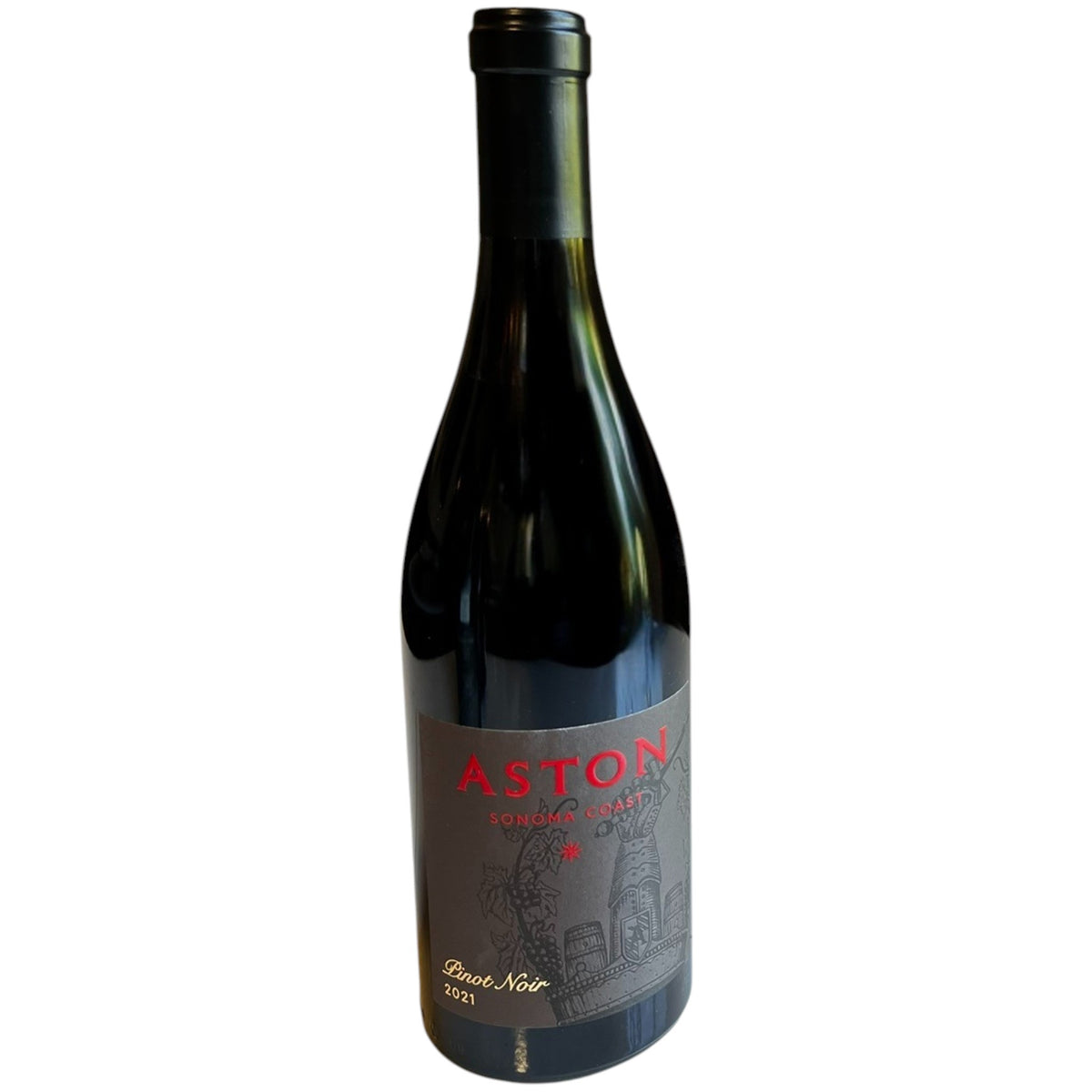 A bottle of ASTON ESTATE PINOT NOIR 2021 with a dark label featuring red text and a wine-themed illustration, sitting on a white table.