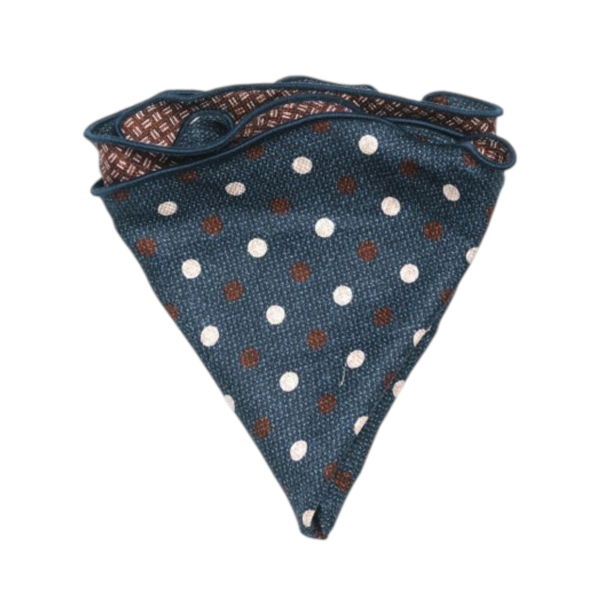 The EDWARD ARMAH - SILK REVERSIBLE POCKET CIRCLE NAVY DOTS is shown neatly folded on a white background, highlighting its blue side with white and brown polka dots and contrasting geometric pattern on the reverse.