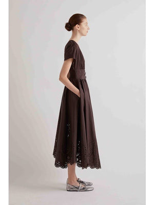 A solid brown square evokes the minimalist style of the MEIMEIJ V Neck Laser Cut Dress by MEIMEIJ—understated and elegant.