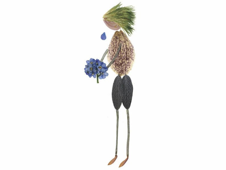 The PETAL PEOPLE PRESS - WITH SYMPATHY CARD by PETAL PEOPLE PRESS features a whimsical figure crafted from leaves and seeds, resembling a person holding a bouquet of Forget-Me-Not blue flowers. The head is fashioned from a green leaf, the body from a textured seed, and the legs and feet are thin twigs, making it perfect for adding delicate beauty to any sympathy card.