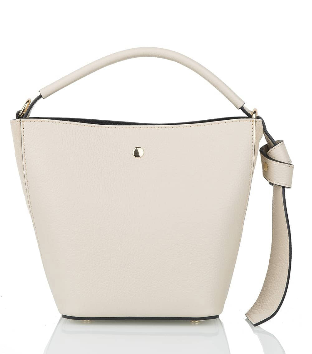 Introducing the SMALL LEATHER BUCKET HANDBAG by LE BORSETTE: This sleek white handbag boasts a structured design with a single top handle and detachable crossbody straps. With its minimalistic style and tiny gold accent on the front, its clean lines and smooth texture provide a modern, sophisticated look.