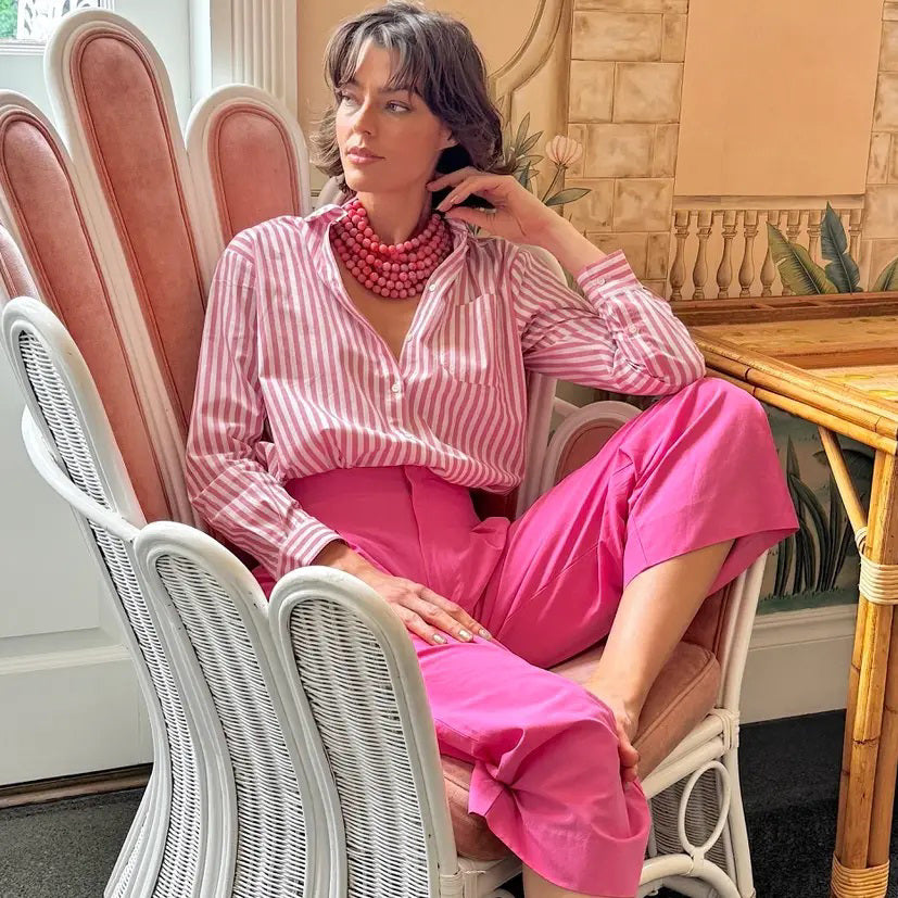 The FAIRCHILD BALDWIN - THE BELLA NECKLACE showcases layered strands of iridescent green Italian resin beads with a faceted design for a shimmering effect, finished with a smooth light green clasp that complements its vibrant hues.