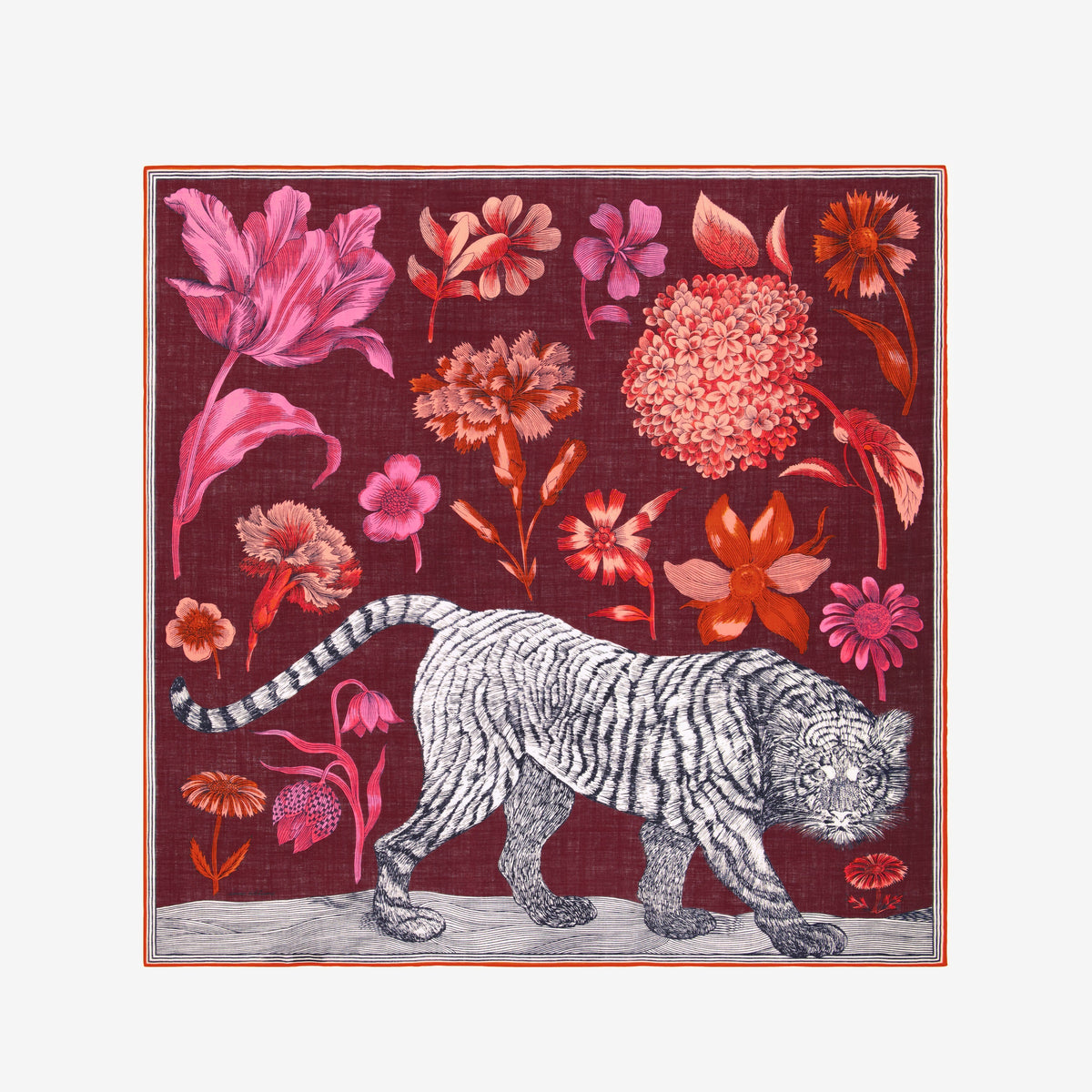A woman with straight dark hair wears a black sweater and the INOUI EDITIONS - GUSTAV WOOL SCARF IN BURGUNDY by INOUI—a large (130 x 130 cm), multicolored patterned scarf crafted in India with cozy wool in rich red, pink, and burgundy tones—set against a plain white background.