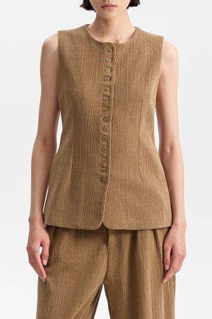 ELEH - THE ATLIER VEST by ELEH: A sleeveless, textured brown crinkle fabric vest with a round neckline and small front buttons, shown against a white background.