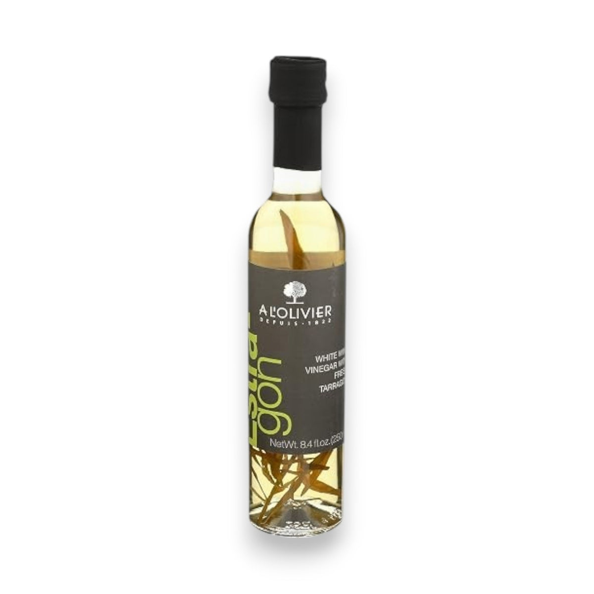 A clear bottle of A L’OLIVER - WHITE WINE VINEGAR TARRAGON from ATALANTA CORPORATION, made with white wine vinegar and infused with aromatic tarragon, features a black cap and a dark label with white and green text, standing on a white background.