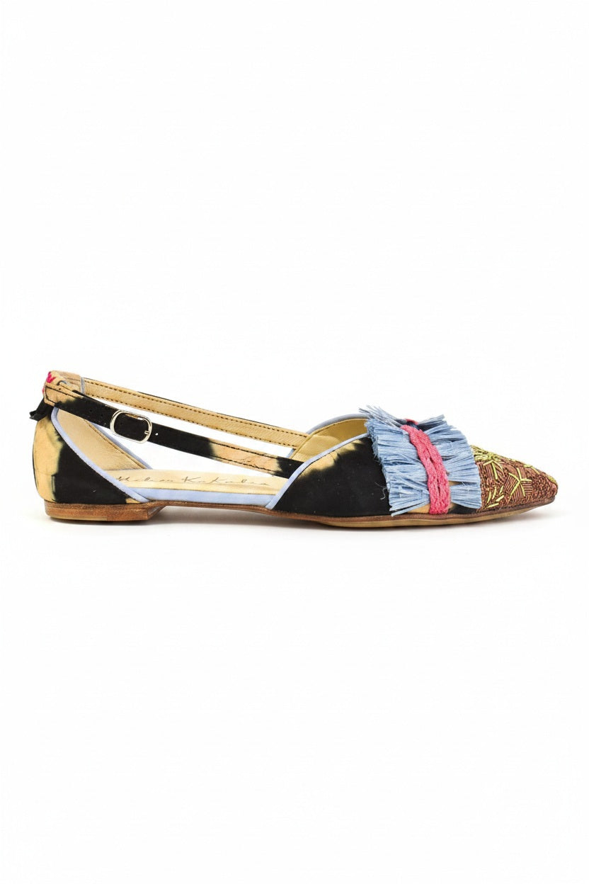 The MEHER KAKALIA GRETA SLINGBACK BLACK BEIGE TO MUDROSE flats feature hand-dyed leather panels, embroidered details, blue and pink fringe accents, a pointed toe, and a low heel for a colorful summer look.