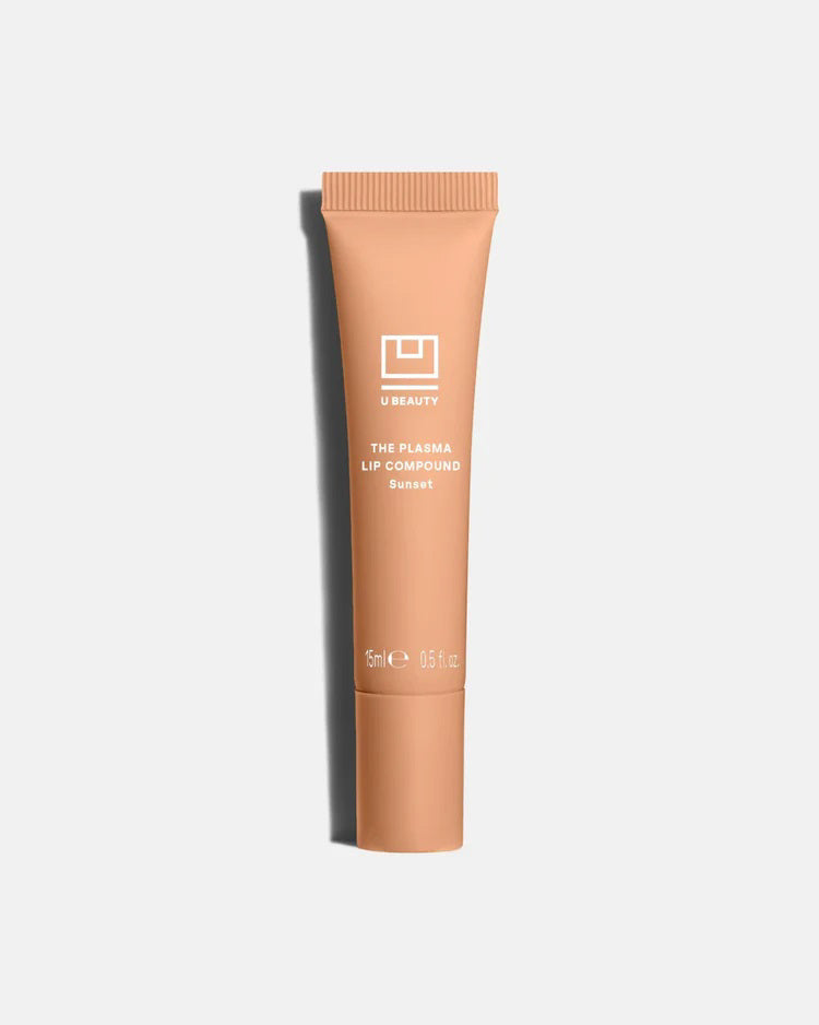 A light gray tube labeled &quot;U BEAUTY - THE PLASMA LIP COMPOUND 15ML&quot; with a screw cap stands upright on a white background, offering advanced hydration and plumping for lips. Brand: U BEAUTY.