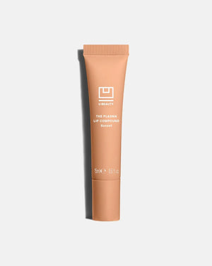 A light gray tube labeled "U BEAUTY - THE PLASMA LIP COMPOUND 15ML" with a screw cap stands upright on a white background, offering advanced hydration and plumping for lips. Brand: U BEAUTY.
