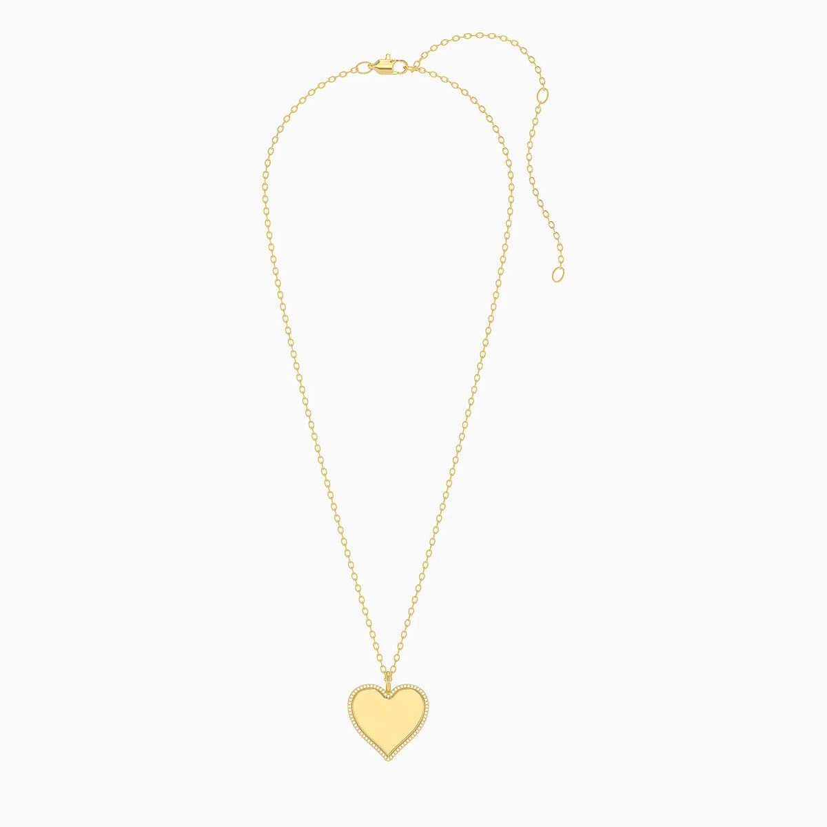 The ELLA STEIN - FOREVER LOVE PENDANT NECKLACE by ELLA STEIN features a gold-plated, heart-shaped pendant outlined with shimmering natural diamonds, suspended from a delicate gold chain and showcased against a plain white background.
