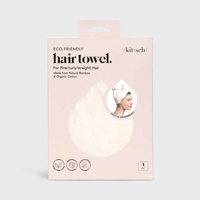The KITSCH - QUICK DRY HAIR TOWEL, made from organic cotton and bamboo, features eco-friendly packaging with a teardrop design that promises frizz reduction for fine, curly, or straight hair. It includes an image of a person wearing the towel.