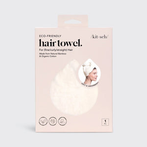 The KITSCH - QUICK DRY HAIR TOWEL, made from organic cotton and bamboo, features eco-friendly packaging with a teardrop design that promises frizz reduction for fine, curly, or straight hair. It includes an image of a person wearing the towel.