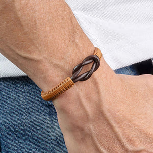 The MAKARLA Men's Infinity Knot Leather Bracelet in chocolate features a handmade design with genuine leather and an adjustable sliding knot, displayed on a white cylindrical stand and labeled by color.