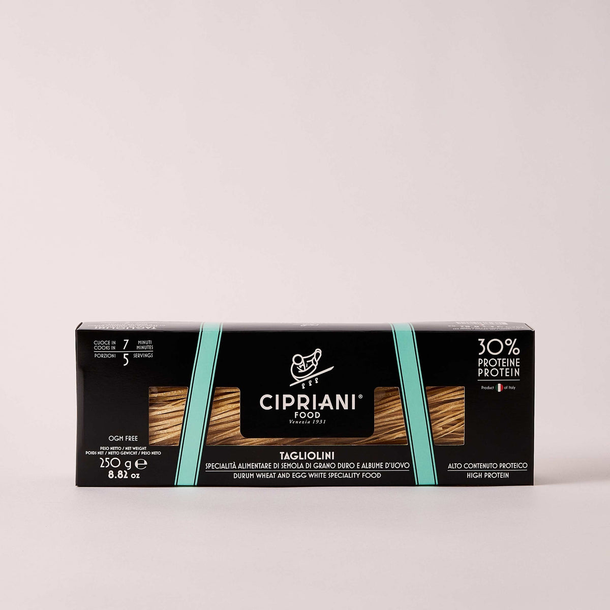 An Atalanta Corporation CIPRIANI - Organic 30% Protein Egg Tagliolini Pasta package. The black box with a turquoise stripe displays the label &quot;CIPRIANI - ORGANIC 30% PROTEIN EGG TAGLIOLINI&quot; and details such as &quot;30% Protein&quot; and &quot;380g.&quot; The pasta strands, made from Italian Durum Wheat Semolina, are visible through two transparent sections on the front.