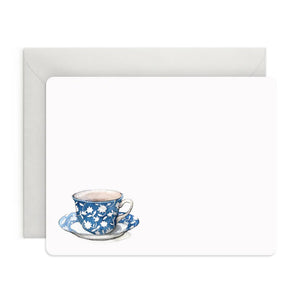 A set of 8 watercolor notecards with envelopes, presented in a light green box. Each card features a blue floral-patterned teacup on a saucer. The band around the box reads "E. FRANCES PAPER - SPOT OF TEA FLAT NOTES.