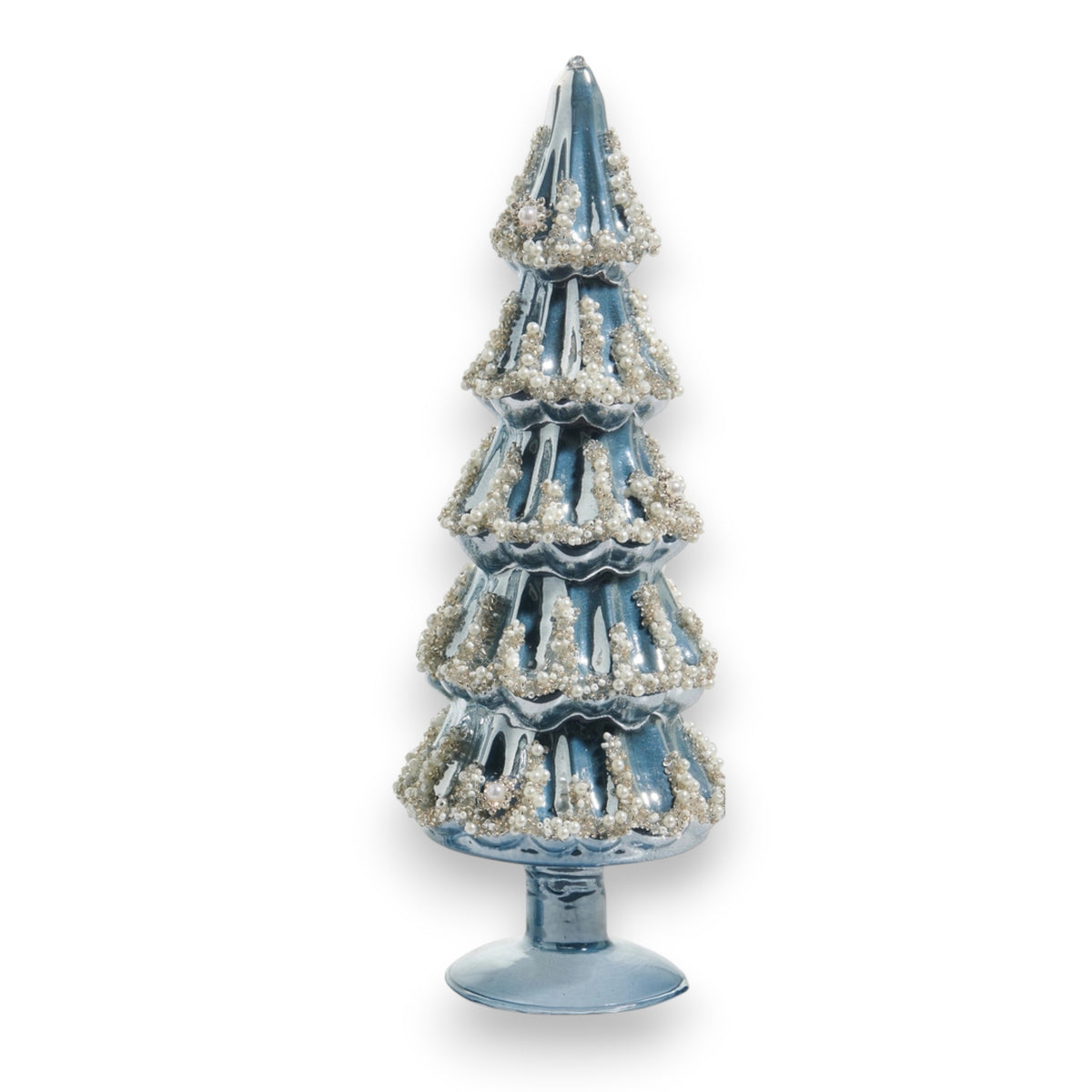 The EMBELLISHED PEARLIZED BLUE AND SILVER GLASS TREE – LARGE by RAZ IMPORTS features shimmering blue and silver glass, making a stunning holiday display beside a glass vase.