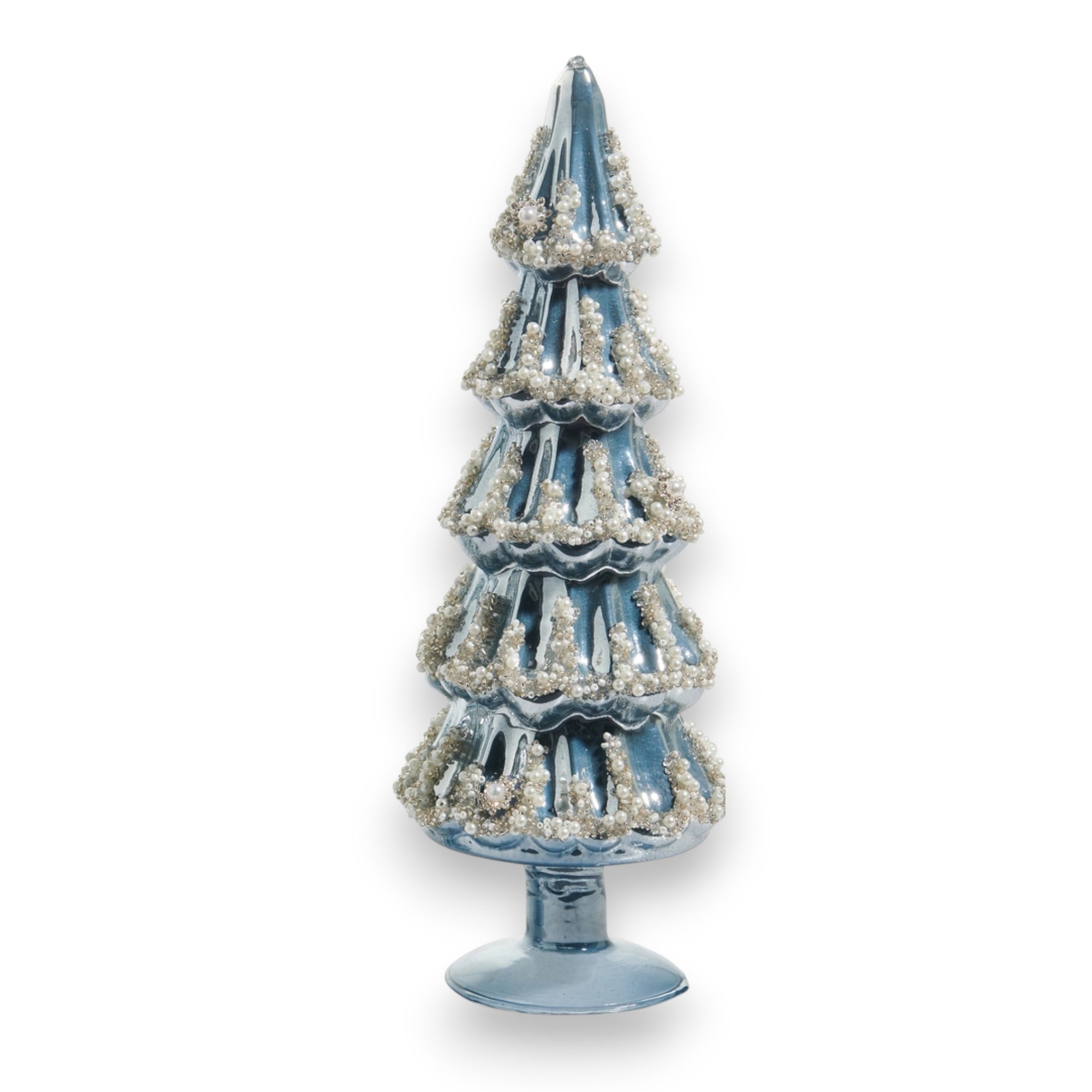 The EMBELLISHED PEARLIZED BLUE AND SILVER GLASS TREE – LARGE by RAZ IMPORTS features shimmering blue and silver glass, making a stunning holiday display beside a glass vase.