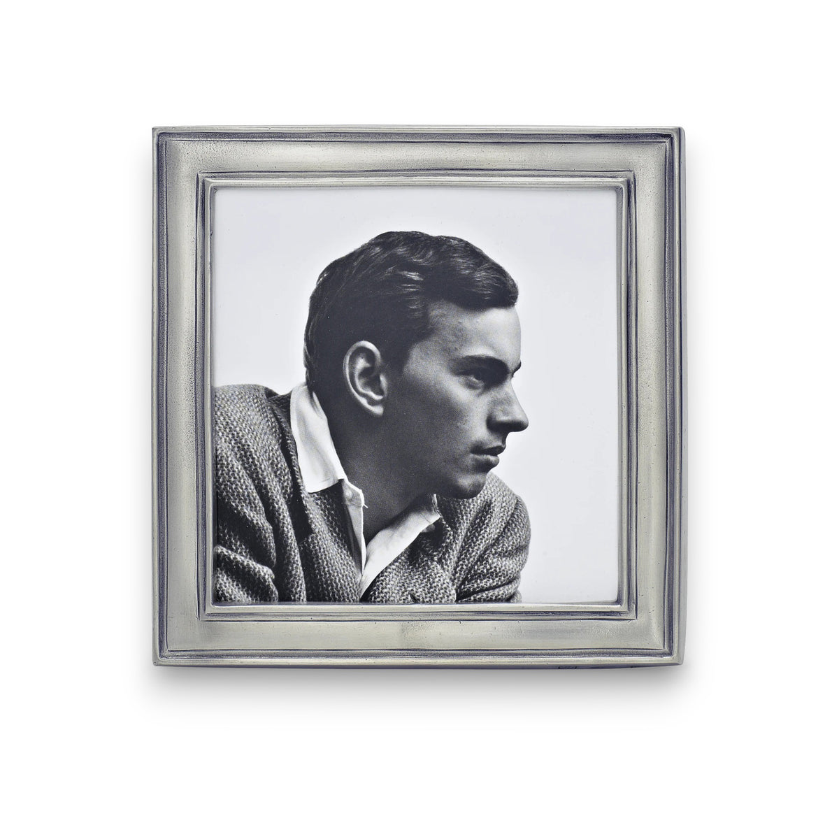 Black and white profile photo of a man in a textured jacket and collared shirt, showcased in the MATCH - LUGANO PEWTER PHOTO FRAME by MATCH, featuring a square shape and elegant wood backing, set against a white background.