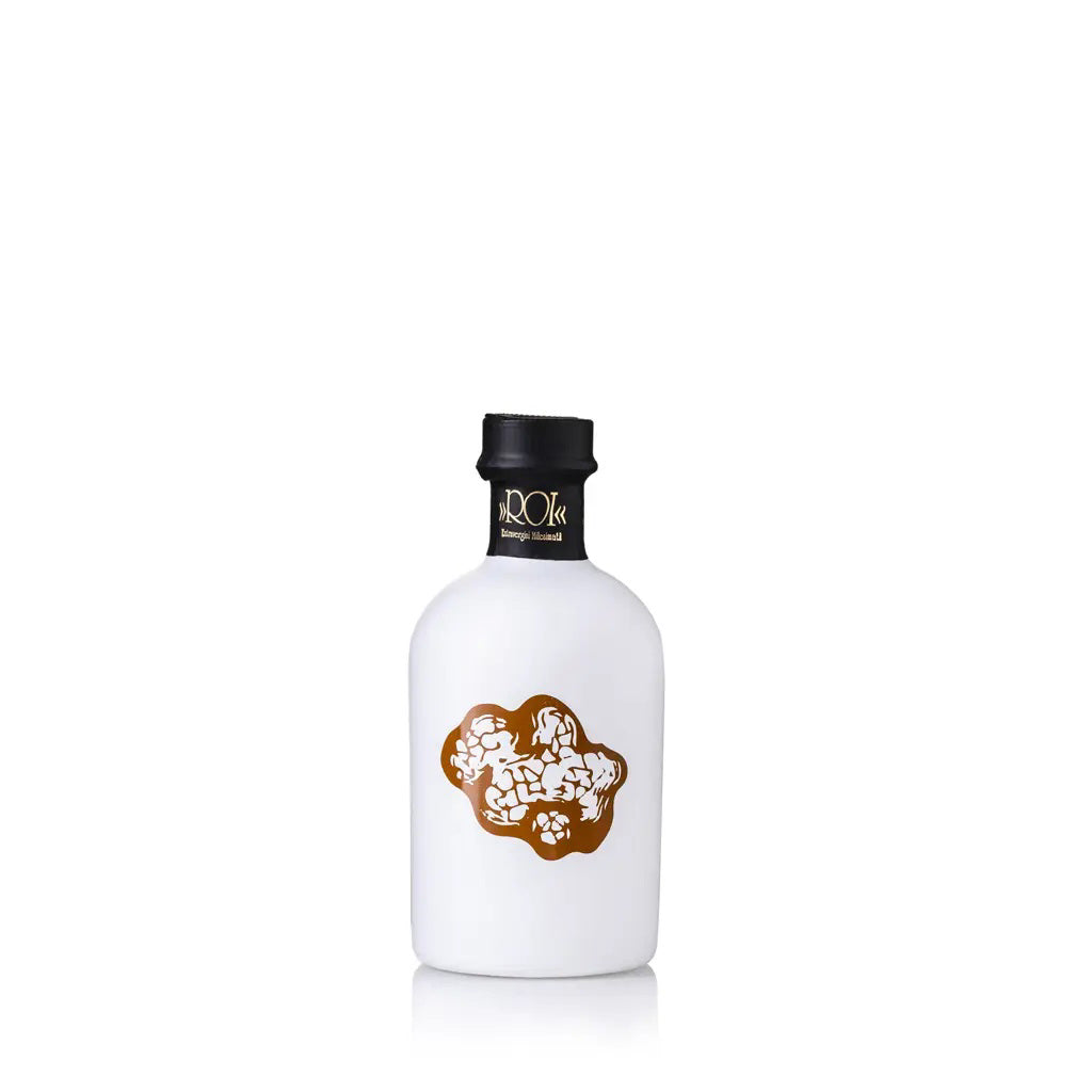 A bottle of OLIO ROI's TARTUFOLIO TRUFFLE OIL, featuring a white body with a black cap and adorned with an elegant gold graphic on the front. Made in Italy, this bottle showcases a sleek, minimalistic design and is set against a plain white background.