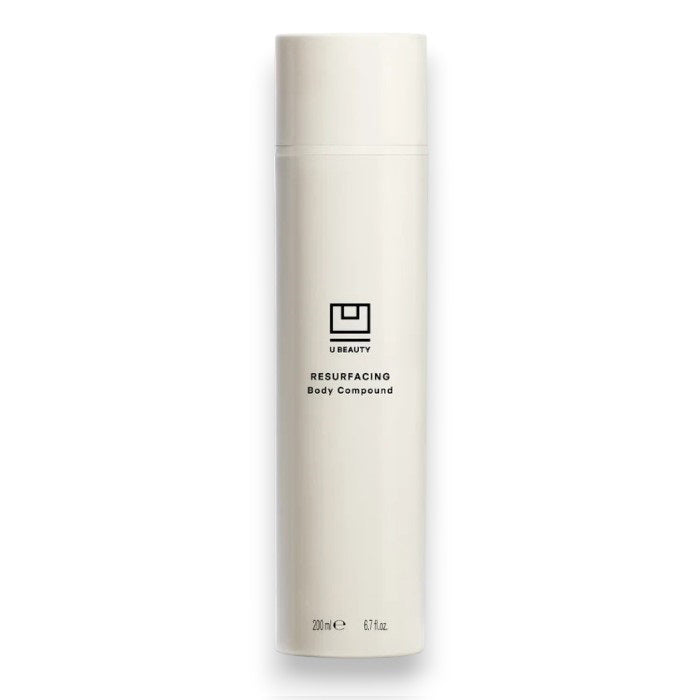 A tall, white bottle with a minimalist design and black text displays &quot;U BEAUTY RESURFACING BODY COMPOUND 200ML.&quot; This body exfoliant is formulated to improve skin texture for a smoother look.