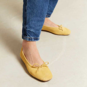 REQINS - HARMONY SUEDE BALLERINA FLATS IN OCHRE: a pair of ochre suede ballet flats with a small bow detail at the toes.