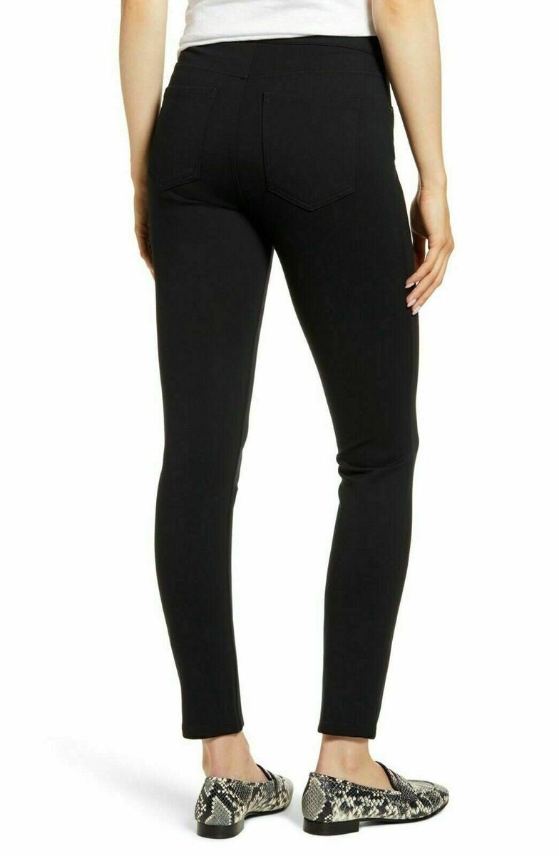 The SPANX Perfect Pant Ankle 4 Pocket leggings in black are showcased on a white background. These women&#39;s leggings, made from smoothing ponte fabric, feature a high waistband and a sleek ankle backseam skinny silhouette with a convenient pull-on design for effortless style.