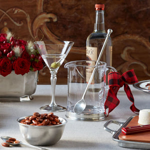 The MATCH - BRANCH BAR PITCHER by MATCH, with a handle and metallic base, is shown filled with ice cubes against a white background—ideal for serving bourbon and branch in style.