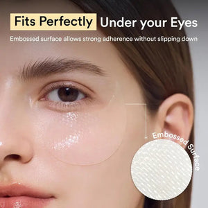 A white jar labeled "ABIB - COLLAGEN EYE PATCH JERICHO ROSE JELLY 60 PCS" from ASIAN BEAUTY WHOLESALE with a translucent eye patch being lifted—ideal for under-eye bags—sits beside a small green plant.