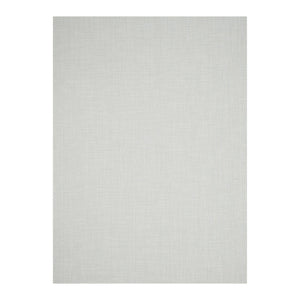 A simple wooden chair with a curved backrest and white metal legs sits on the CHILEWICH MINI BASKETWEAVE RUNNER 2.5X8, made from phthalate-free TerraStrand yarns, against a white wood-paneled wall.