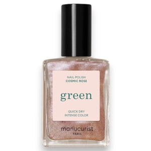 A bottle of MANUCURIST INC GREEN™ Nail Polish in the shade “Cosmic Rose,” showcasing a shimmering rose gold pink hue and topped with a black cap. The label features “green” and “quick dry intense color,” highlighting its vegan and non-toxic formula.