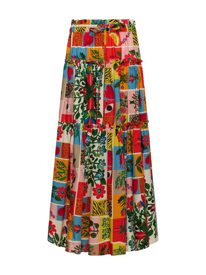 The FRANCO FERRARI Cotton Tiered Max Skirt is an A-line maxi skirt featuring large abstract orange, green, and blue flowers on a light background. Made from cotton, it offers comfort with an elasticized drawstring waist for an adjustable fit.