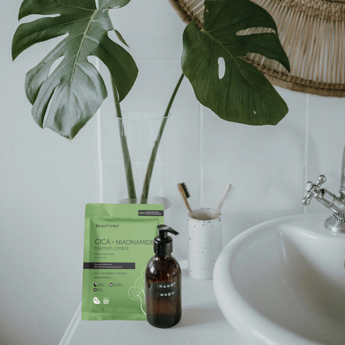 The BEAUTYPRO - CICA + NIACINAMIDE BLEMISH CONTROL MASK, presented in green packaging under the trusted BEAUTY PRO brand, promises to minimize pores, brighten skin, and provide anti-aging benefits. It features a biodegradable mask and packaging made with natural plant ingredients and is paraben-free.