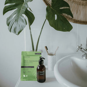 The BEAUTYPRO - CICA + NIACINAMIDE BLEMISH CONTROL MASK, presented in green packaging under the trusted BEAUTY PRO brand, promises to minimize pores, brighten skin, and provide anti-aging benefits. It features a biodegradable mask and packaging made with natural plant ingredients and is paraben-free.