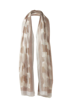 The KINROSS CASHMERE - BRUSHSTROKE PRINT CASHMERE SCARF by KINROSS features a lightweight, translucent fabric with a beige and white abstract geometric pattern and slightly frayed edges, displayed hanging to highlight its length.