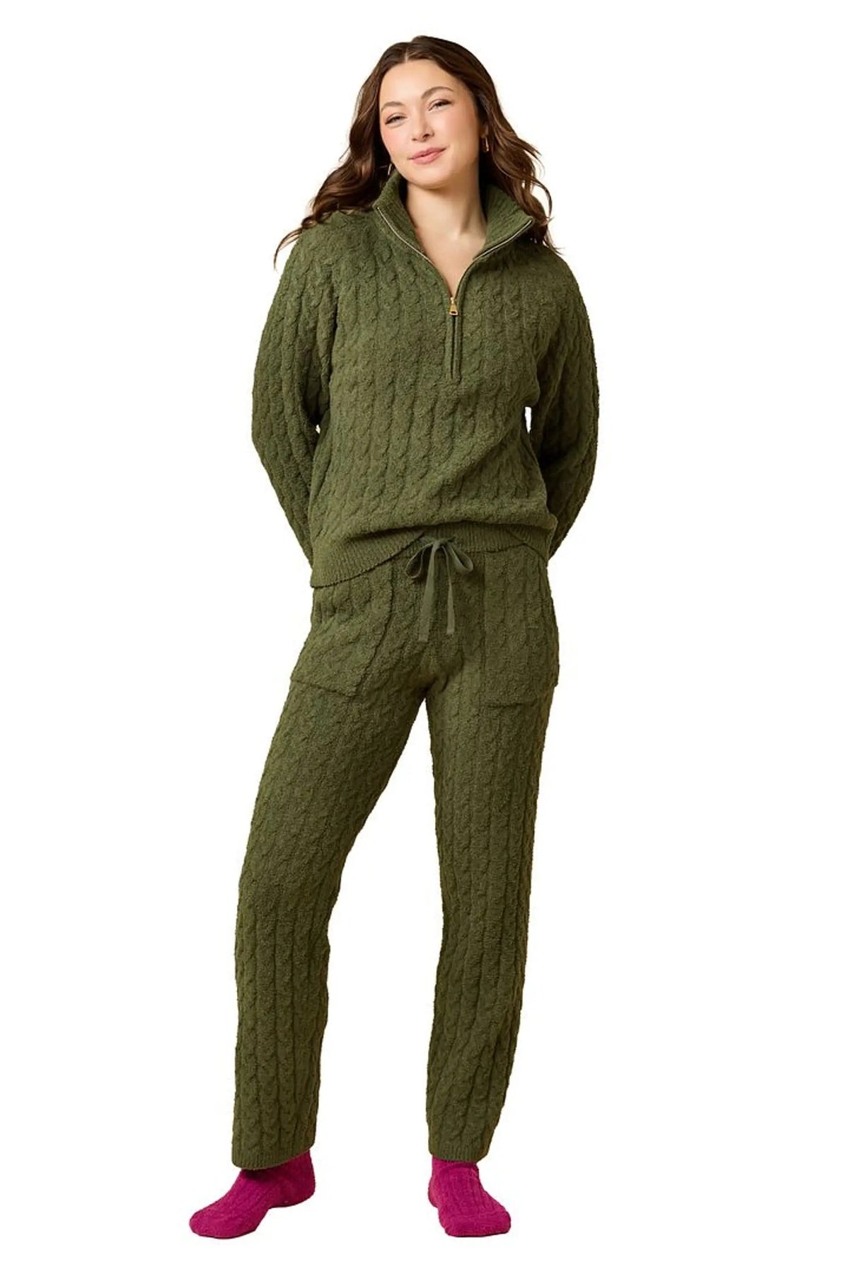 A woman wearing a marshmallow-soft, cream-colored SOFTIES - CABLE KNIT MARSHMALLOW ½ ZIP WITH TAPERED PANT SET, featuring a half-zip pullover and matching pants with a drawstring waist.