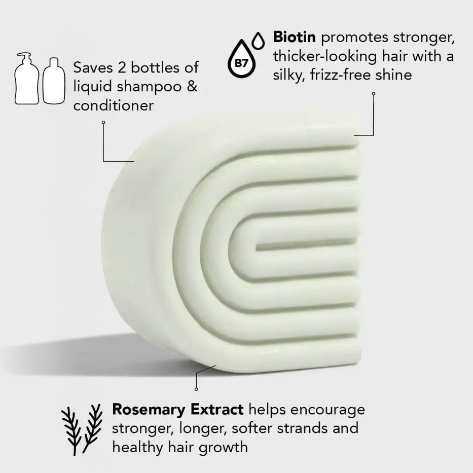 The image shows a box and curved light green bar of KITSCH's color-safe, pH-balanced, vegan Volumizing Solid Conditioner with rosemary and biotin, labeled "Kitsch Rosemary and Bioton Volumizing Solid Conditioner.