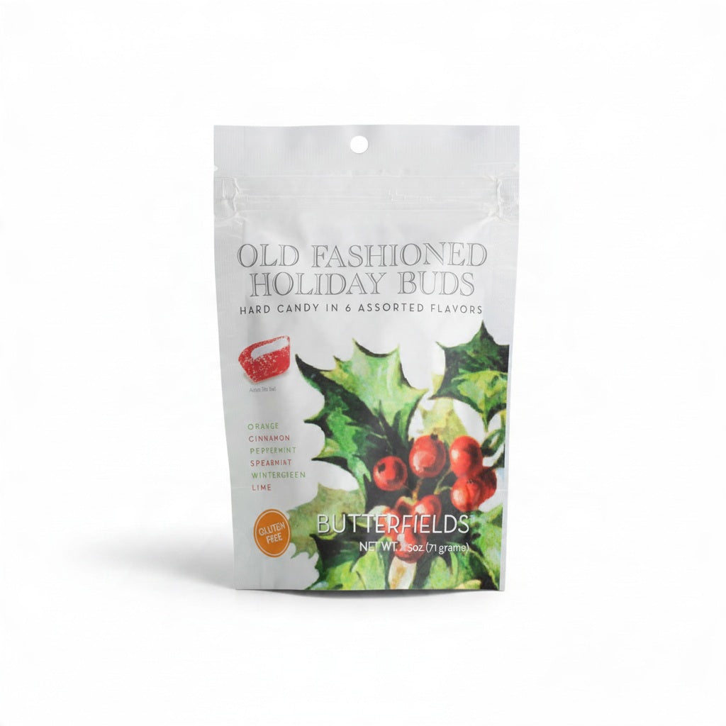 A BUTTERFIELDS - HOLIDAY BUDS stand-up pouch of hard candy featuring a holly illustration, a list of six flavors including cinnamon and peppermint, and a gluten-free label.
