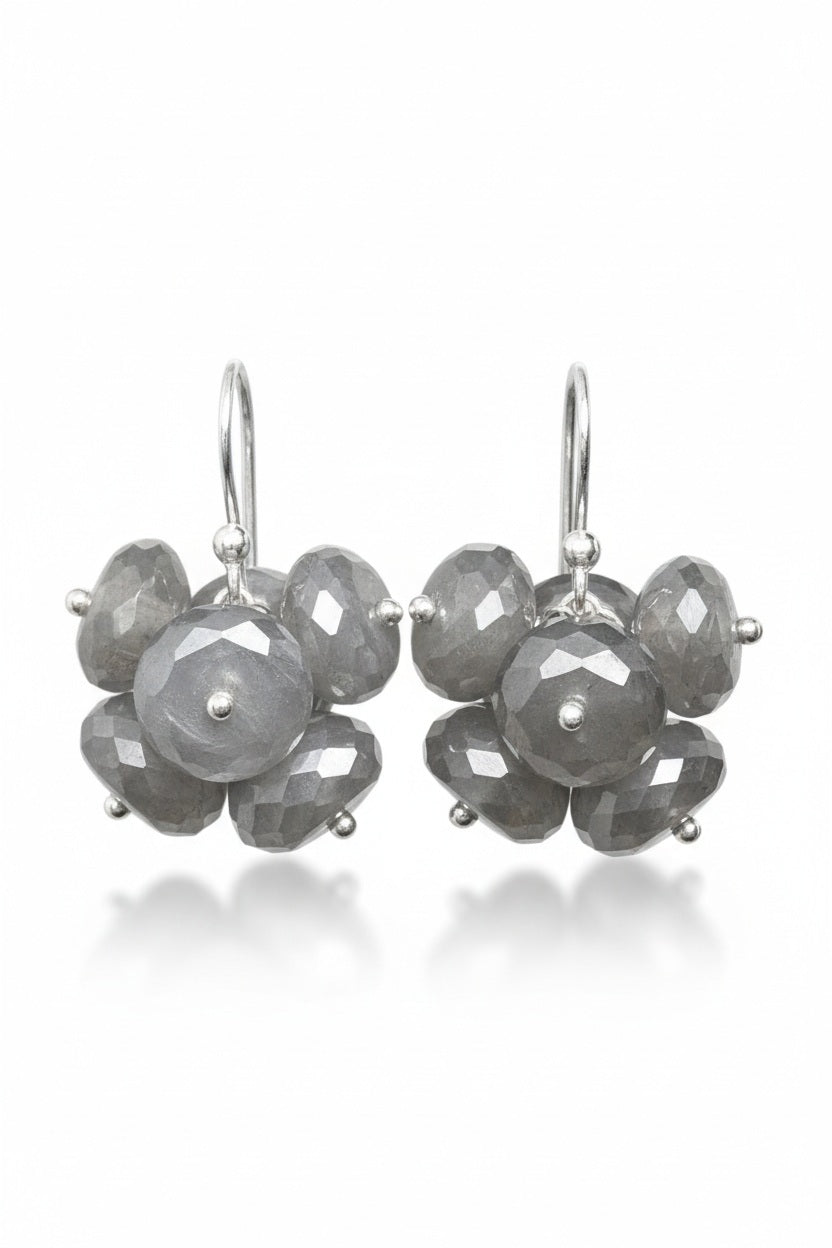 Introducing the ANN LIGHTFOOT - MOONSTONE CLUSTER EARRINGS by ANN LIGHTFOOT, a pair of elegant earrings featuring faceted moonstone gemstones arranged in a delicate, flower-like cluster design and finished with sterling silver hooks.