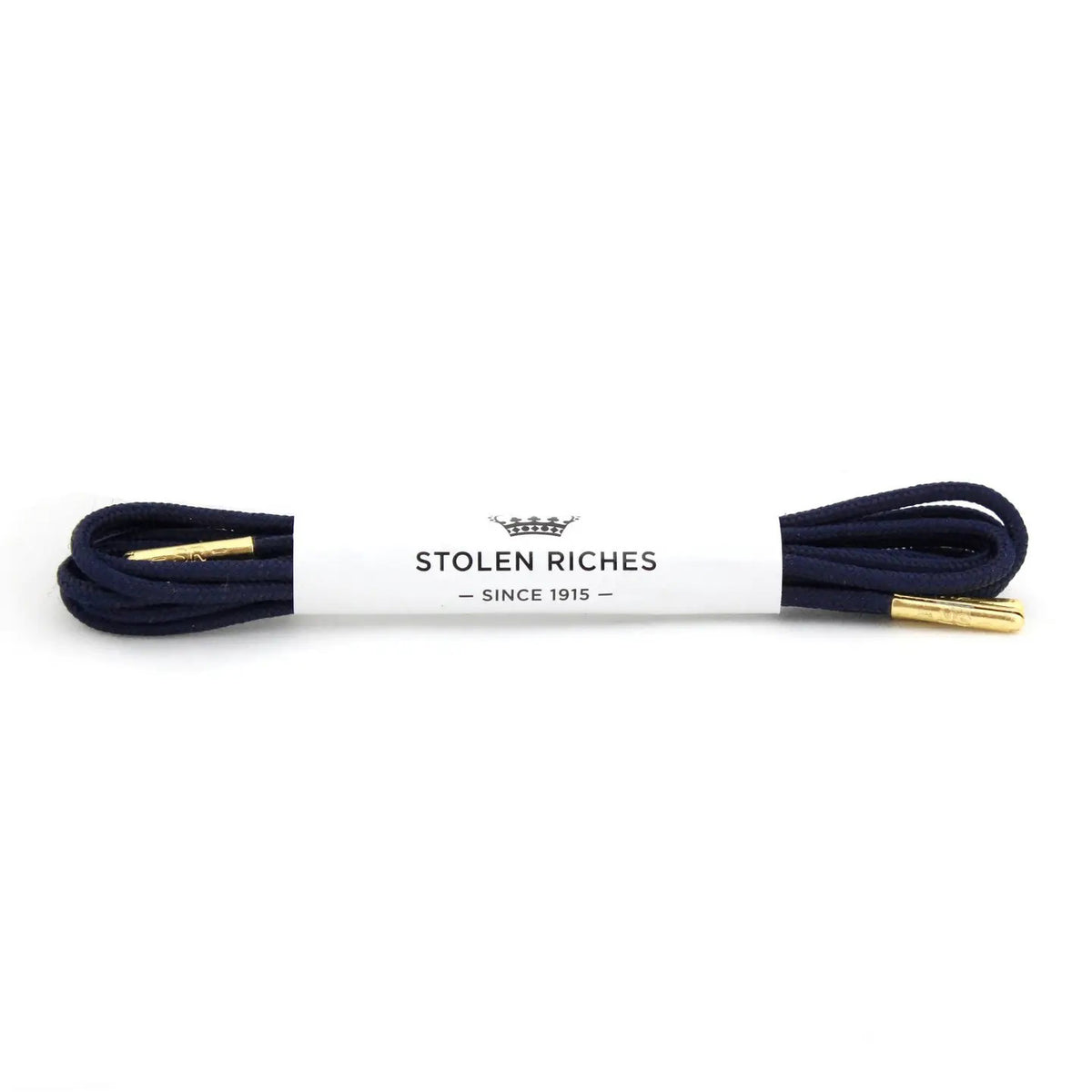 The STOLEN RICHES Dress Shoelace in Mission Blue features premium navy laces with gold metal tips, bundled and secured by a white band labeled "Stolen Riches - Since 1915" with a crown logo.