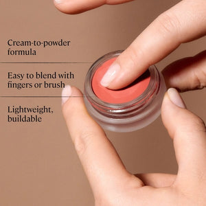 A single swatch of MINORI - CREAM BLUSH in Scarlet sweeps across a white background, revealing its creamy texture and rich pigment—capturing the effortless glow of a natural-looking blush from MINORI.