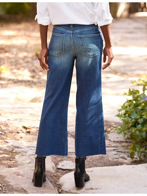 The FRANK & EILEEN Galway Wide Leg Jean in 1999 Wash features a faded ombre effect, cropped raw hem with unfinished edge, classic five-pocket styling, and visible stitching for an effortlessly cool look.