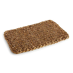 The NAPA HOME AND GARDEN - SEAGRASS RECTANGULAR PLACEMAT, made from natural fibers with a textured pattern, is shown on a white background. A perfect piece for home decor.