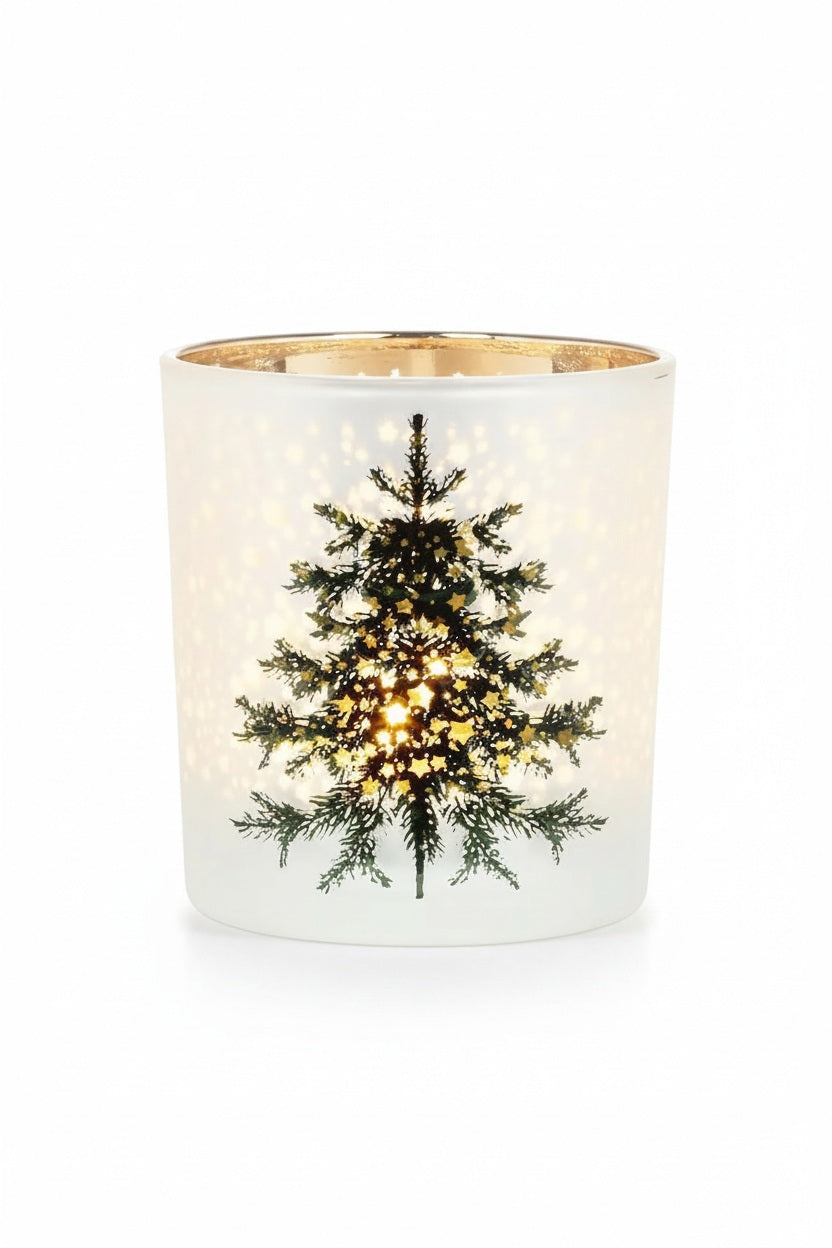 FROST TREE AND STARS VOTIVE HOLDER by ABBOTT, a frosted glass votive holder decorated with pine tree and star cutouts, illuminated from within to create a festive evergreen tree candle display.