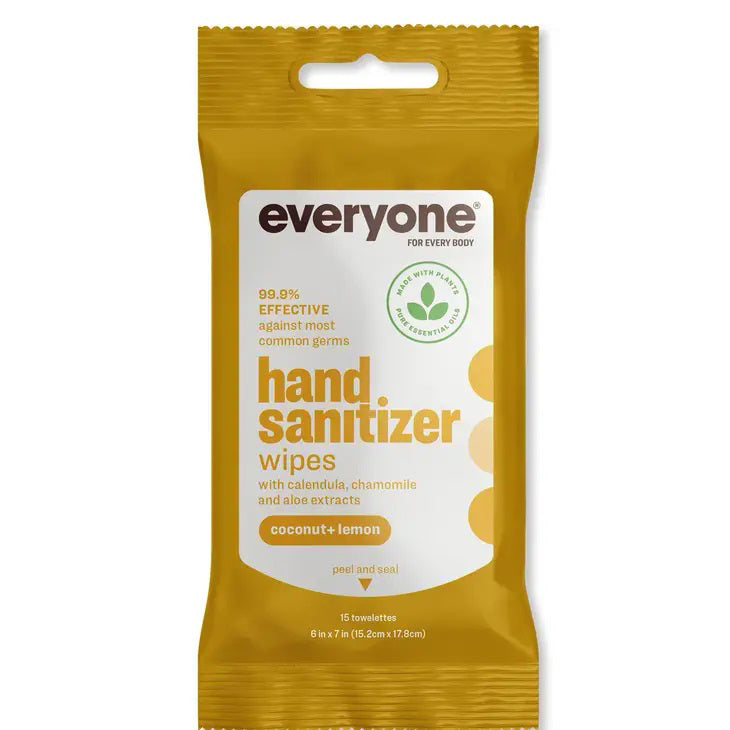 A package of Everyone for Everybody Coconut &amp; Lemon Hand Sanitizer Wipes is displayed. The text on the yellow package indicates it contains 15 resealable wipes with calendula, chamomile, and aloe extracts. It features non-GMO sugar cane-derived alcohol, ensuring 99.9% effectiveness against most common germs.