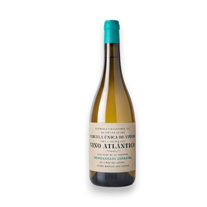A bottle of VINO ATLANTICO TXAKOLINA 2022 by WINE: A-VIN-GARDE/BORDEAUX FINE & RARE, with a teal cap and cream label featuring black and green Spanish text, stands upright against a plain white background.