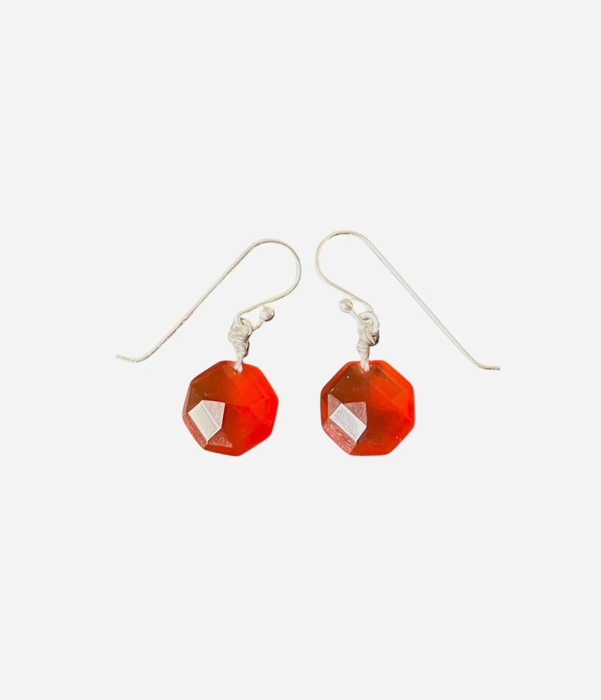 The ANN LIGHTFOOT Red Agate Octagon Coin Earrings feature elegant faceted red agate stones set in sterling silver hooks, displayed against a plain white background.