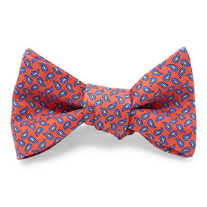 A self-tie, adjustable neck bow tie from Bird Dog Bay, the PETER-BLAIR New Pine Silk Bow Tie in Pink and Blue features a repeating blue and pink pattern, laid flat on a white background. This handmade bow tie is crafted from printed silk for a refined and elegant finish.