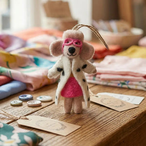 DELLIE THE FASHION POODLE ORNAMENT, a felt poodle wearing pink goggles, a zebra print coat, and a neon pink mini skirt.