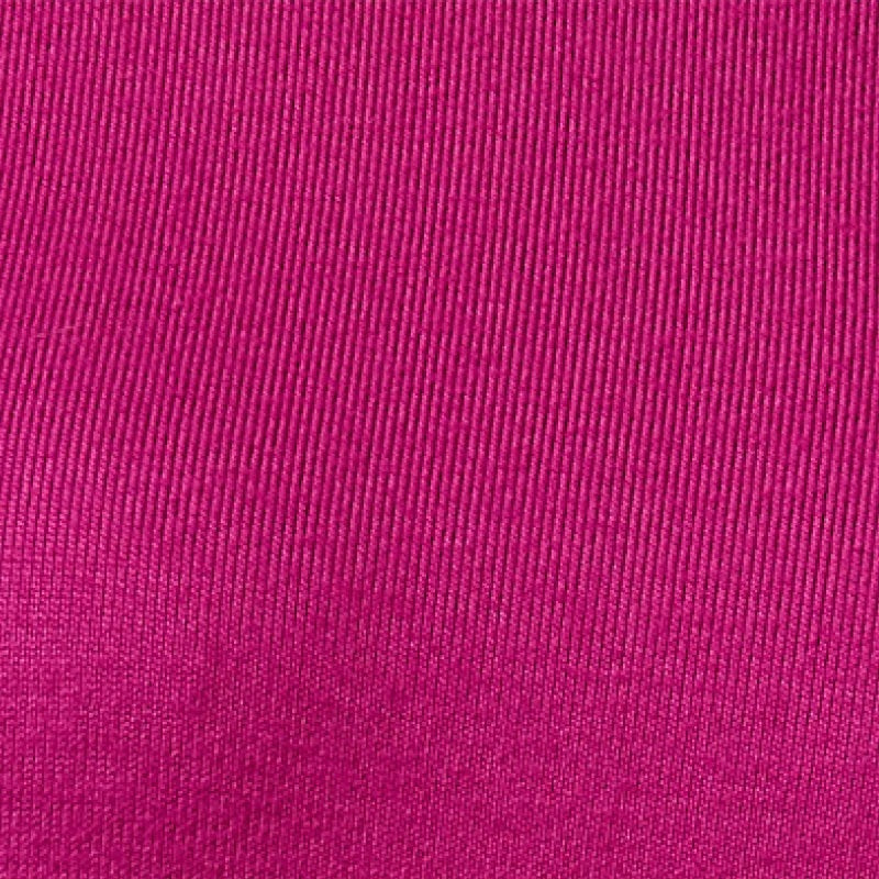 A woman wears a SOFTIES - DREAM RELAXED V-NECK WITH CAPRI LOUNGE SET in magenta, featuring a V-neck top with elbow-length sleeves and matching cropped drawstring pants, paired with cream-colored loafers.